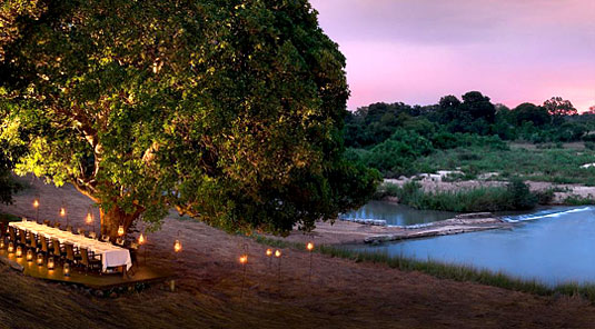 Dining near the river at Dulini River Lodge in the Big 5 Sabi Sand Private Game Reserve located in South Africa