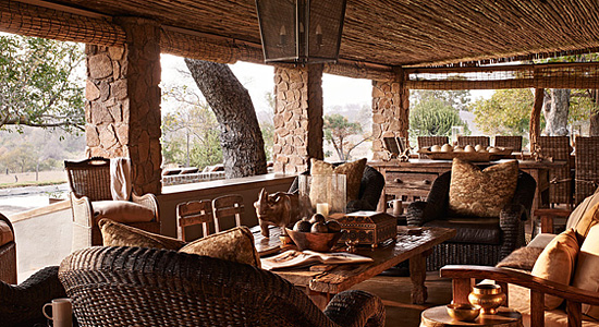 View of the cosy verandah and dining table at Singita Castleton Camp located in the Sabi Sand Game Reserve, South Africa Singita Castleton Camp Verandah Singita Private Game Reserve Exclusive Villa Sabi Sand Game Reserve